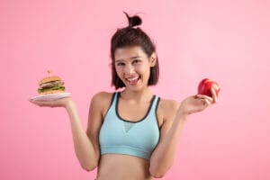 Asian Woman Choosing Hamburger Red Apple Pink